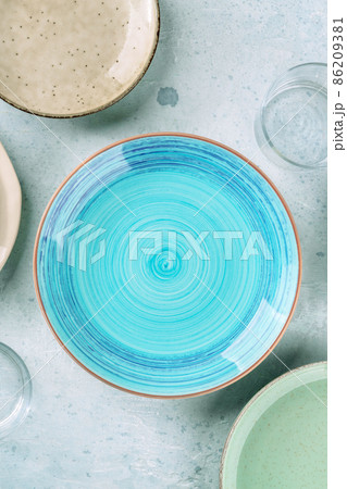 Modern tableware with a blue plate, shot from the top Modern tableware with a blue plate, shot from the top 86209381