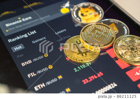Cryptocurrency on Binance trading app, Bitcoin BTC with BNB, Ethereum, Dogecoin, Cardano, Litcoin, altcoin digital coin crypto currency defi p2p decentralized finance and fintech banking market 86211125