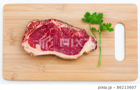 fresh marbled meat on a wooden hardboard 86213607