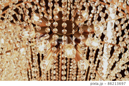 Luxury ceiling crystal chandelier in hotel close-up 86213697