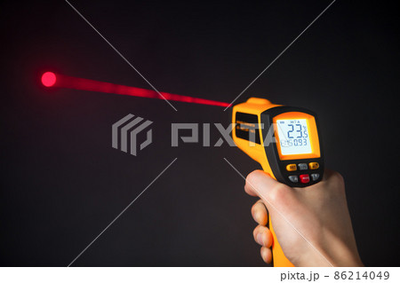 infrared laser thermometer in hand 86214049