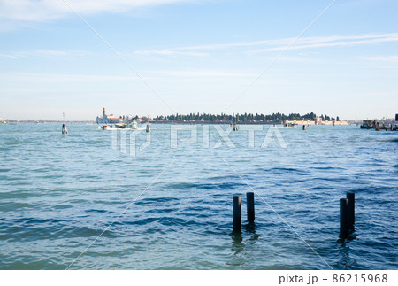 Venice typical landscape. Boat floating on canal. Italian landmark. 86215968
