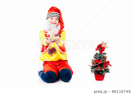 A baby dressed as a elf. isolated. Santa's helper. boy in suit of dwarf or elf A baby dressed as a elf. isolated. Santa's helper. boy in suit of dwarf or elf 86216748