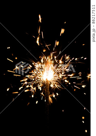 yellow sparkler with fire particles 86217511