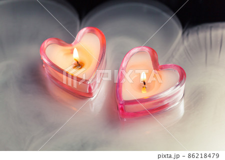 burning candle hearts in dense fog 86218479
