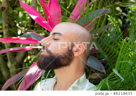 bearded man in a green shirt profile portrait 86218635
