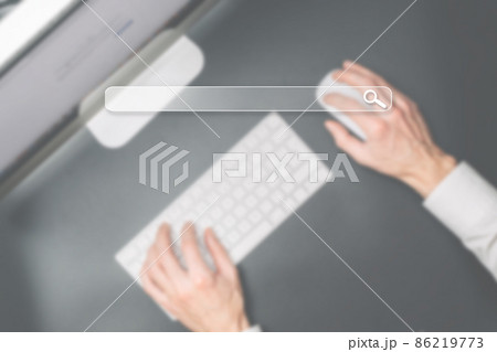 Searching internet. Online website search engine selective focus. Blured hands using computer for searching browsing internet data information networking concept. Searching internet. Online website search engine selective focus. Blured hands using computer for searching browsing internet data information networking concept. 86219773