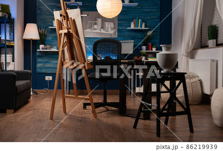 Empty architecture studio with drawings and white vase Empty architecture studio with drawings and white vase 86219939