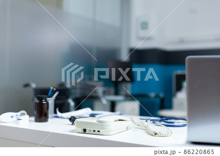Modern empty doctor office equipped with professional medical instruments Modern empty doctor office equipped with professional medical instruments 86220865
