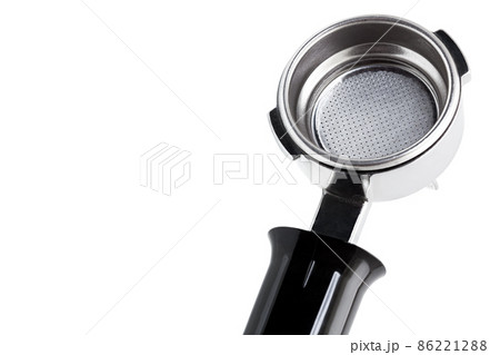 Holder from coffee maker with ground coffee, object isolated on white background with copy space. 86221288