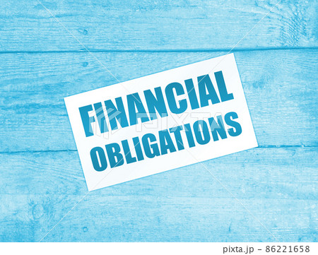 Financial Obligation words on card on wooden table. Business debts concept Financial Obligation words on card on wooden table. Business debts concept 86221658