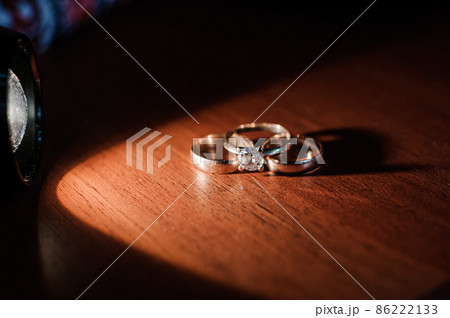 Wedding gold rings on brown background 86222133