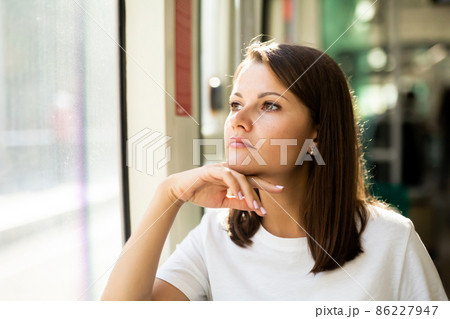 Female passenger in public land transport 86227947