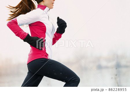 Winter running athlete woman on cold run jogging 86228955
