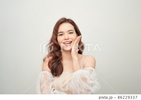 Tender portrait of romantic young girl wearing lace dress Tender portrait of romantic young girl wearing lace dress 86229337