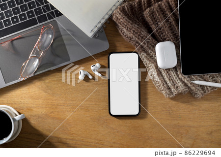 Simple feminine office desk with smartphone mockup on wooden table. 86229694