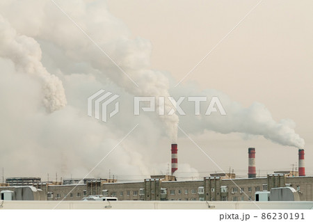 industrial chimneys with heavy white smoke causing air pollution problem 86230191