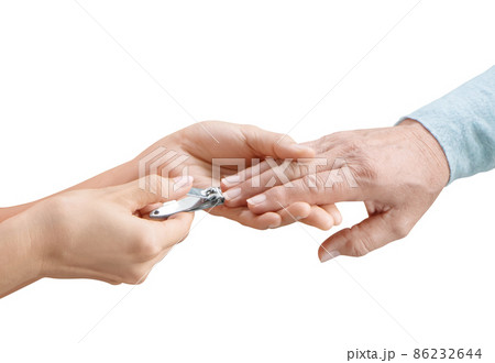 Daughter hands help cutting nails with nail clipper for mother 86232644