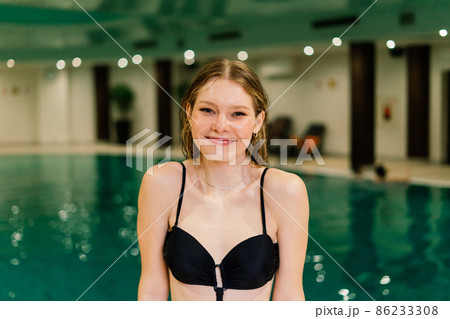 Portrait of beautiful woman in swimwear relaxing in swimming pool spa. Portrait of beautiful woman in swimwear relaxing in swimming pool spa. 86233308