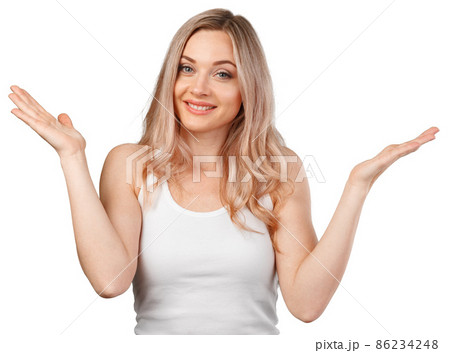 Portrait of uncertain young woman with blonde hair standing with raised arms isolated on white Portrait of uncertain young woman with blonde hair standing with raised arms isolated on white 86234248