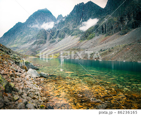 A landscape with mountains and mountain lake 86236165