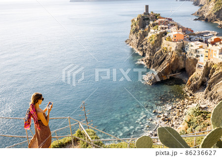 Woman traveling famous Cinque Terre towns in northwestern Italy Woman traveling famous Cinque Terre towns in northwestern Italy 86236627