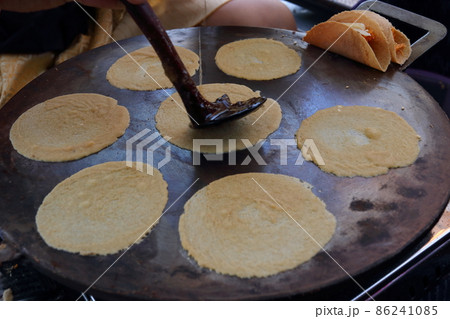 Preparing Thai ancient crispy crepe on plate. Preparing Thai ancient crispy crepe on plate. 86241085