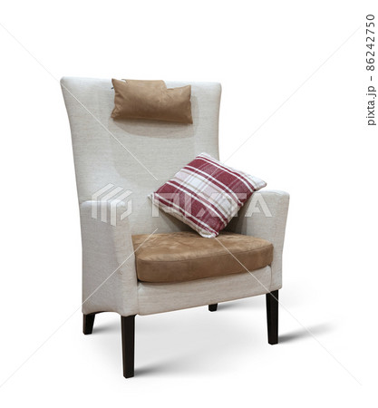 modern tall beige armchair with pillow isolated on white background. studio shot modern tall beige armchair with pillow isolated on white background. studio shot 86242750