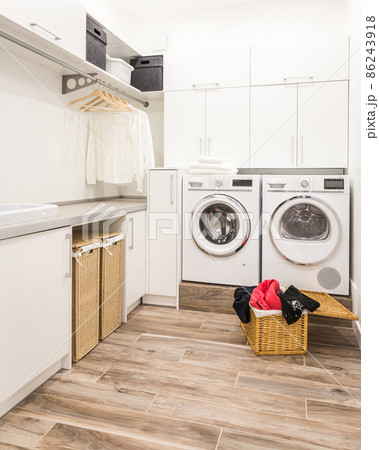 Laundry room with basket and dirty clothes Laundry room with basket and dirty clothes 86243918