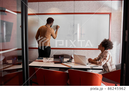 Attractive young colleagues are working together in office Attractive young colleagues are working together in office 86245962