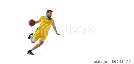 Flyer with sportive man, professional basketball player in action, motion with ball isolated on white studio background. Sport, motion, activity, movement concepts. 86248477
