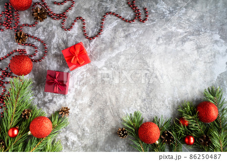 Branches of a Christmas tree with cones, Christmas balls , on a light background.Top view. Perfect Christmas background 86250487