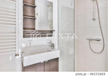 Luxury interior design of a bathroom with marble walls Luxury interior design of a bathroom with marble walls 86253869