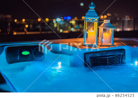 Hot tub with candles ready to take a bath. Valentines day concept Hot tub with candles ready to take a bath. Valentines day concept 86254525