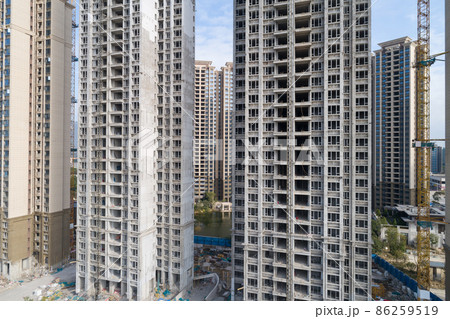 Aerial view of multistory apartment construction site in China Aerial view of multistory apartment construction site in China 86259519
