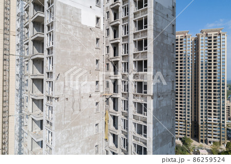Aerial view of multistory apartment construction site in China Aerial view of multistory apartment construction site in China 86259524