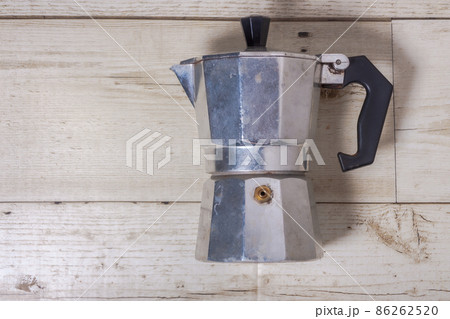 Moka Pot on a wooden floor Coffee pot on a wooden floor Moka Pot on a wooden floor Coffee pot on a wooden floor 86262520