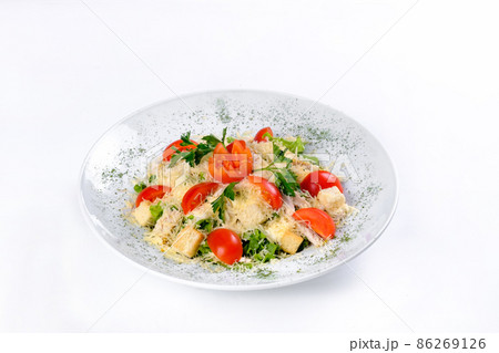 Greek rustic salad with feta cheese, olives, tomatoes. vegetarian Mediterranean cuisine, on a white isolated background Greek rustic salad with feta cheese, olives, tomatoes. vegetarian Mediterranean cuisine, on a white isolated background 86269126