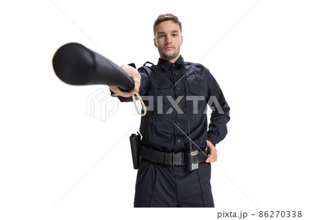 Front camera view. Young male policeman officer wearing black uniform looking at camera isolated on white background. Concept of job, caree, law and order. Front camera view. Young male policeman officer wearing black uniform looking at camera isolated on white background. Concept of job, caree, law and order. 86270338