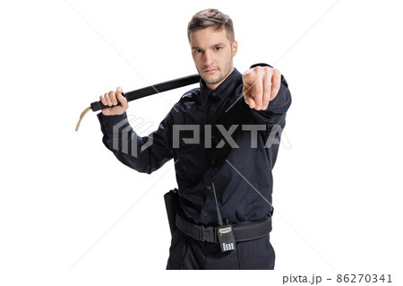 Half-length portrait of young male policeman officer wearing black uniform posing isolated on white background. Concept of job, caree, law and order. Half-length portrait of young male policeman officer wearing black uniform posing isolated on white background. Concept of job, caree, law and order. 86270341