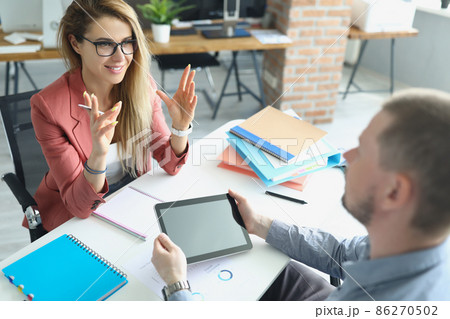 Male and female meet in office to discuss upcoming project 86270502