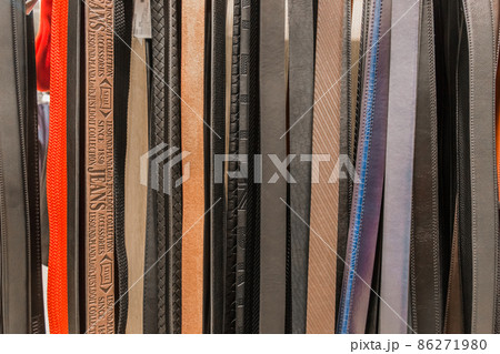 A set of different fashionable leather belts collection of men's accessories for pants and jeans 86271980