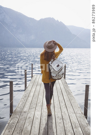 beautiful girl in a hat on the pier 86273989