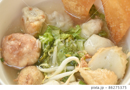 boiled Hakka meatball made from chop pork stuffing fried tofu with bean sprout and lettuce in soup on bowl boiled Hakka meatball made from chop pork stuffing fried tofu with bean sprout and lettuce in soup on bowl 86275375