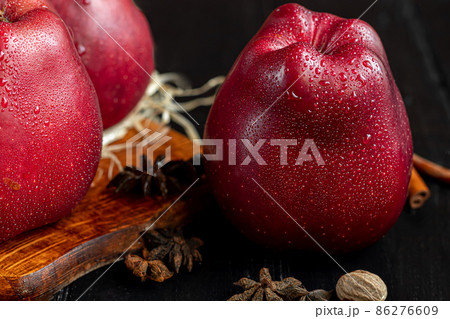 Red apples on a dark, wooden background. Selective focus. Harvesting. Healthy food. 86276609