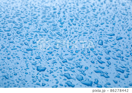 Water drops on light blue background, closeup view 86278442