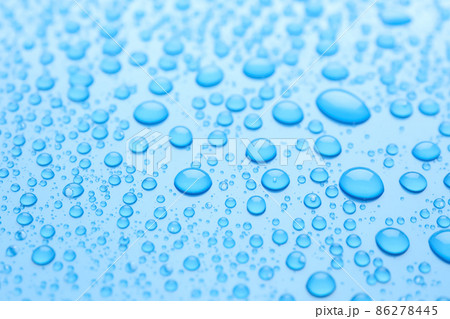 Water drops on light blue background, closeup view 86278445