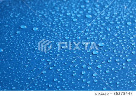 Water drops on blue background, closeup view 86278447