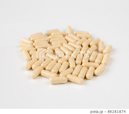 Gelatin capsules with drug on a light background 86281874