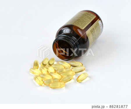 Gelatin capsules with omega-3 and glass bottle on a light background 86281877